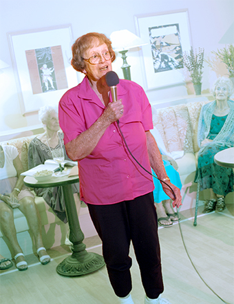 Elderly woman with microphone